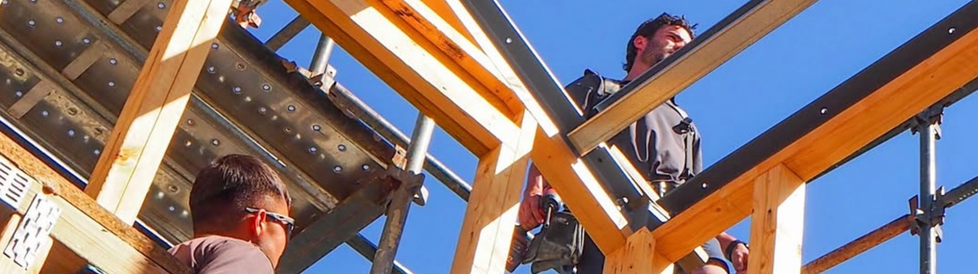 plumbers working with builders on projects