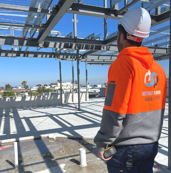 district plumbing working with semi commercial builders